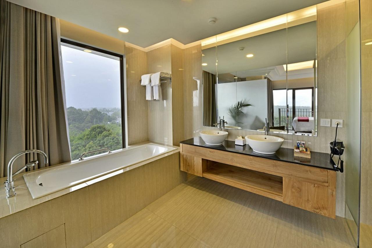 Famvida Hotel Lubuklinggau Oda fotoğraf